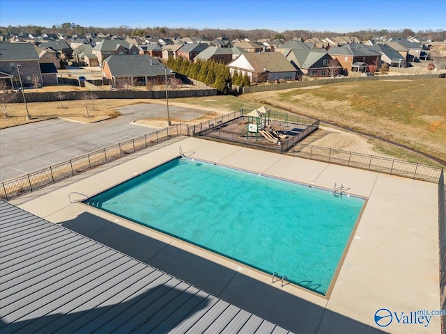 view of swimming pool featuring a patio area