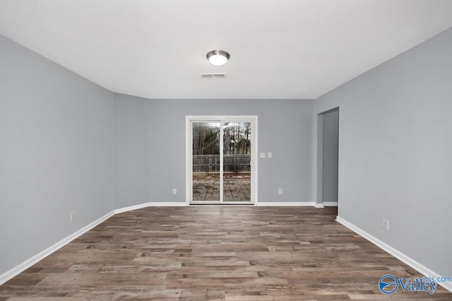 spare room featuring hardwood / wood-style floors