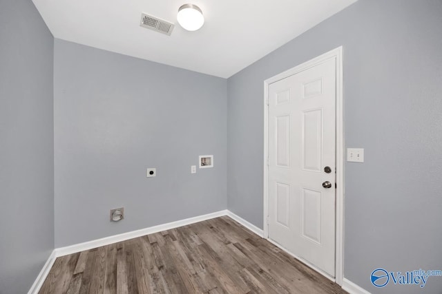 clothes washing area with washer hookup, wood-type flooring, and electric dryer hookup