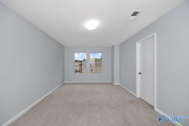 empty room with light colored carpet