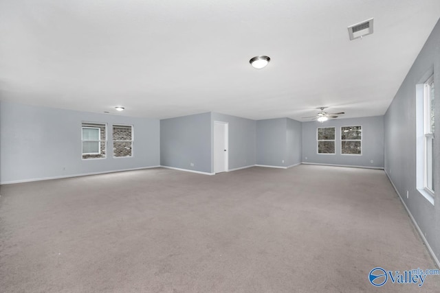 carpeted empty room with ceiling fan