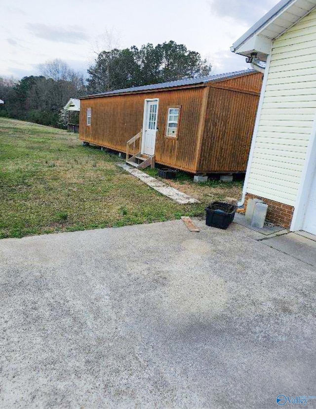 view of side of home featuring entry steps