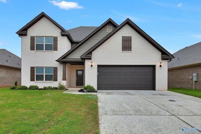 283 Shubert Dr, Hazel Green, AL 35750 - traditional home with concrete driveway, an attached garage, brick siding, and a front yard