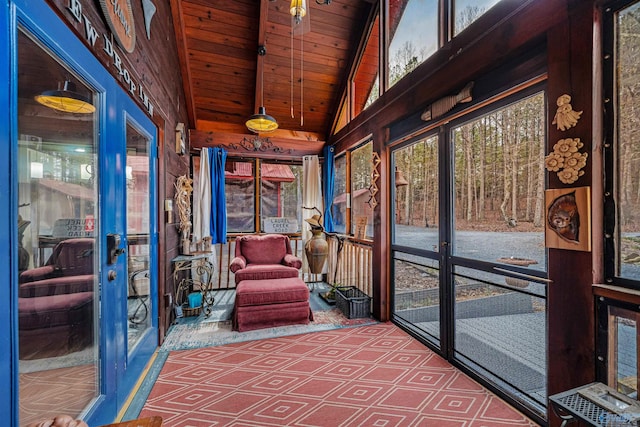 sunroom with lofted ceiling with beams and wooden ceiling