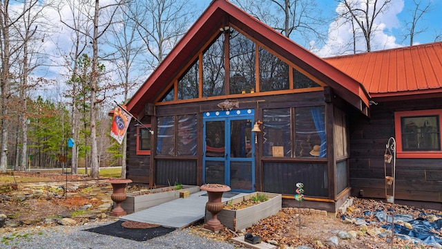 exterior space with metal roof