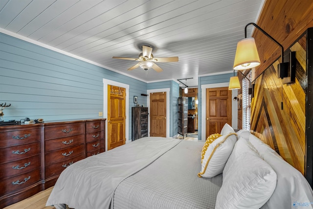 bedroom with wood ceiling, light wood finished floors, and ceiling fan