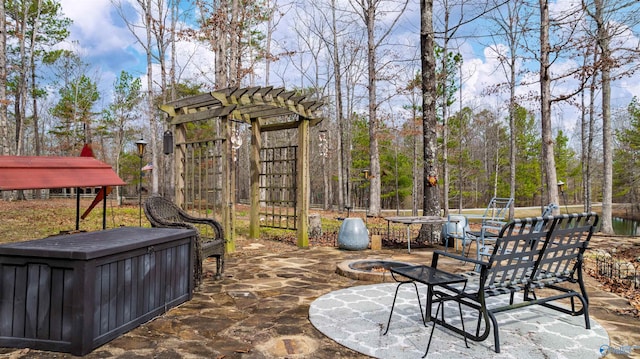 view of patio with a fire pit