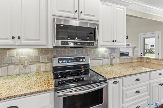 17259 Obsidian Cir, Athens, AL 35613 - kitchen with stainless steel appliances, white cabinets, tasteful backsplash, and light stone countertops