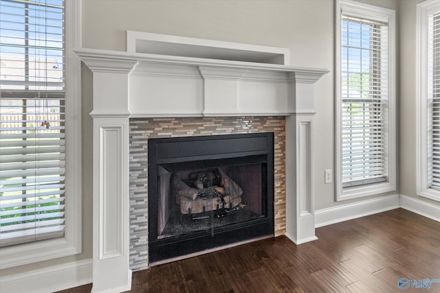 17259 Obsidian Cir, Athens, AL 35613 - detailed view of baseboards, wood finished floors, and a tile fireplace