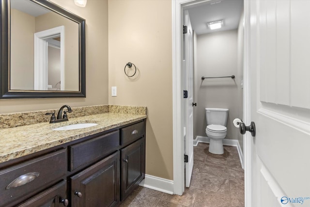 17259 Obsidian Cir, Athens, AL 35613 - bathroom with vanity, toilet, baseboards, and tile patterned flooring