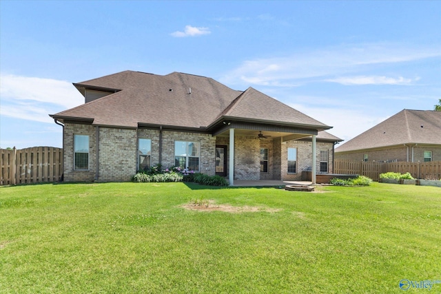 17259 Obsidian Cir, Athens, AL 35613 - back of house featuring a ceiling fan, a shingled roof, brick siding, and an outdoor fire pit