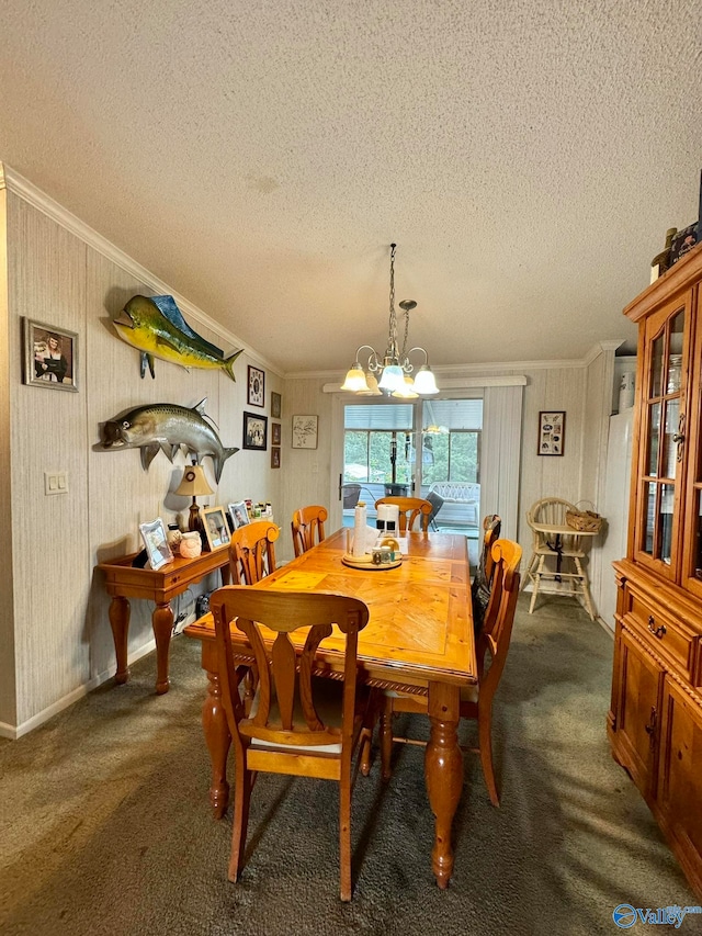 carpeted dining space featuring a textured ceiling, ornamental molding, and a chandelier