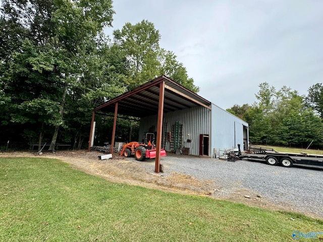 view of outbuilding with a yard