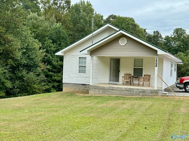 bungalow-style home with a front lawn and covered porch