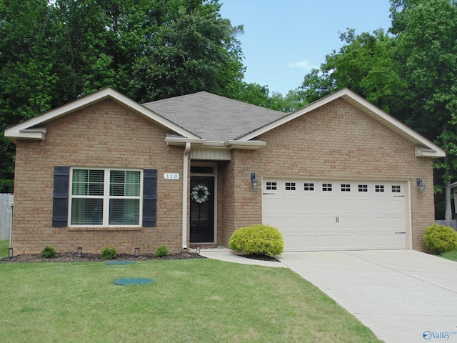 110 Oak Path Ln, Harvest, AL 35749 - single story home with an attached garage, driveway, a front yard, brick siding, and a shingled roof