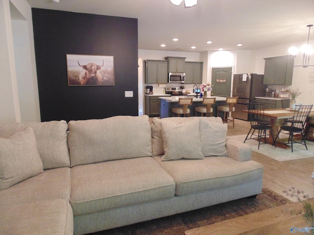 110 Oak Path Ln, Harvest, AL 35749 - living room with light wood-style flooring and recessed lighting