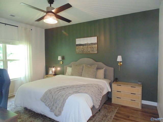 110 Oak Path Ln, Harvest, AL 35749 - bedroom with dark wood-style flooring, baseboards, and a ceiling fan