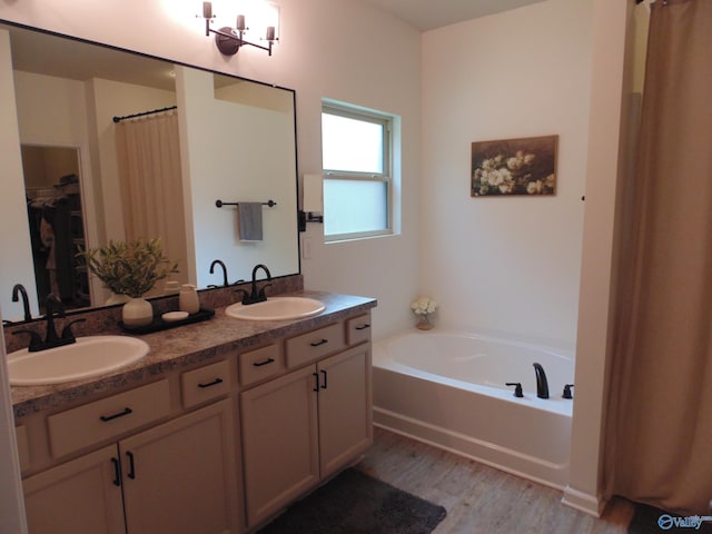 110 Oak Path Ln, Harvest, AL 35749 - full bathroom with wood finished floors, a bath, and double vanity