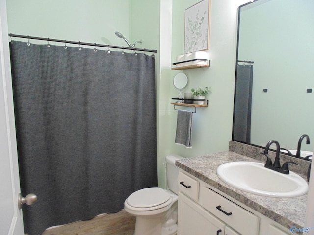 110 Oak Path Ln, Harvest, AL 35749 - bathroom featuring vanity, toilet, wood finished floors, and a shower with curtain
