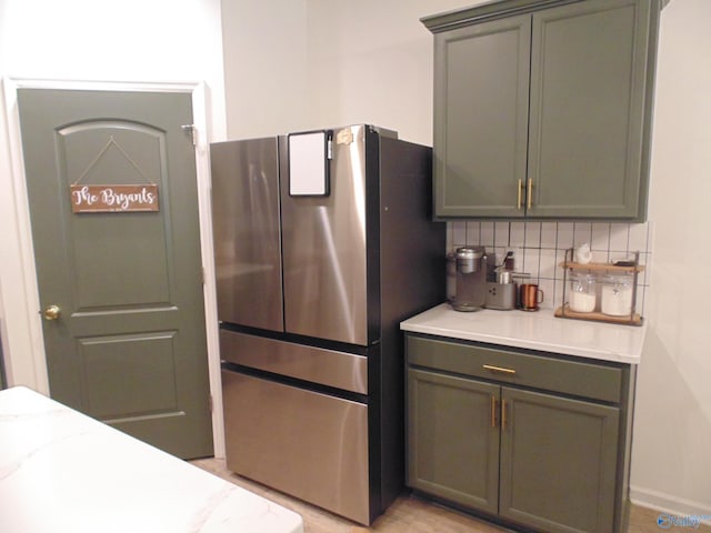 110 Oak Path Ln, Harvest, AL 35749 - kitchen with freestanding refrigerator, backsplash, and gray cabinetry