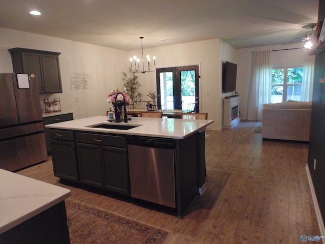 110 Oak Path Ln, Harvest, AL 35749 - kitchen featuring stainless steel appliances, open floor plan, wood finished floors, a chandelier, and recessed lighting