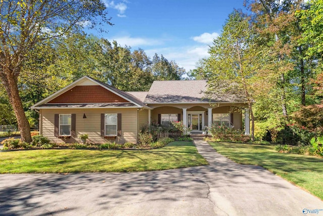 view of front of home with a front lawn and a porch