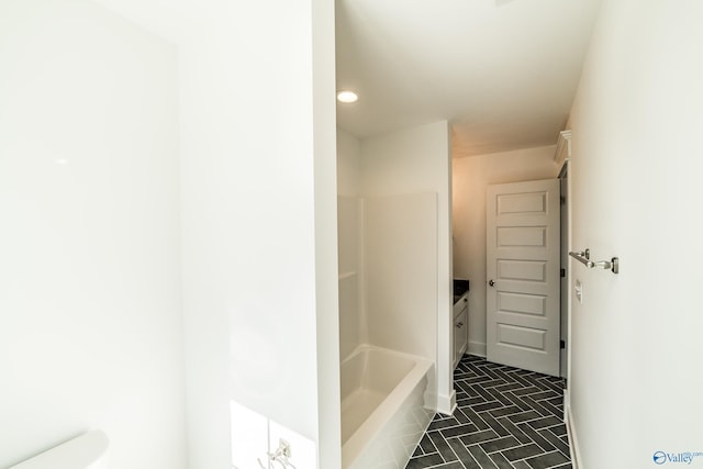 full bath with a shower, a bathtub, and baseboards