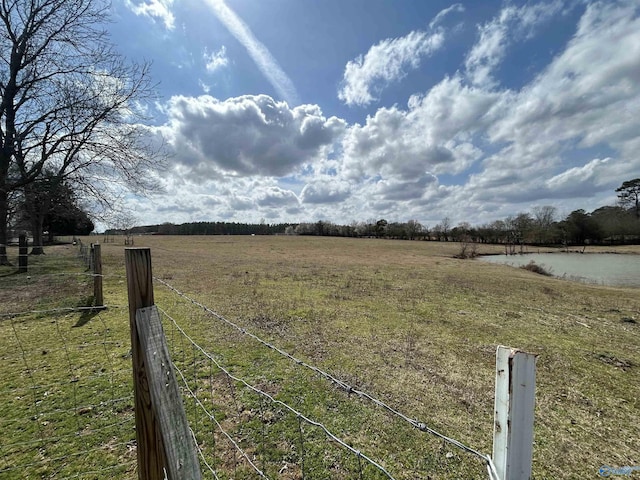 view of yard with a rural view