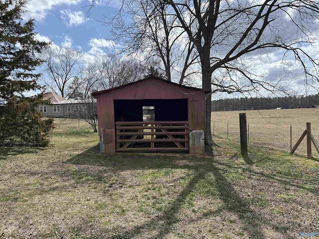 view of pole building with fence