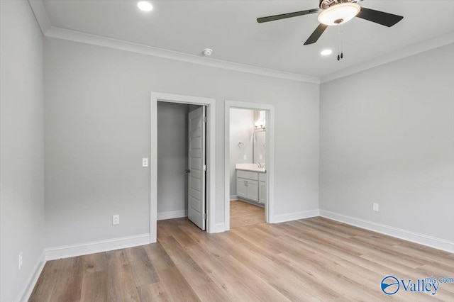 unfurnished bedroom with ornamental molding, light hardwood / wood-style flooring, ensuite bath, ceiling fan, and a closet