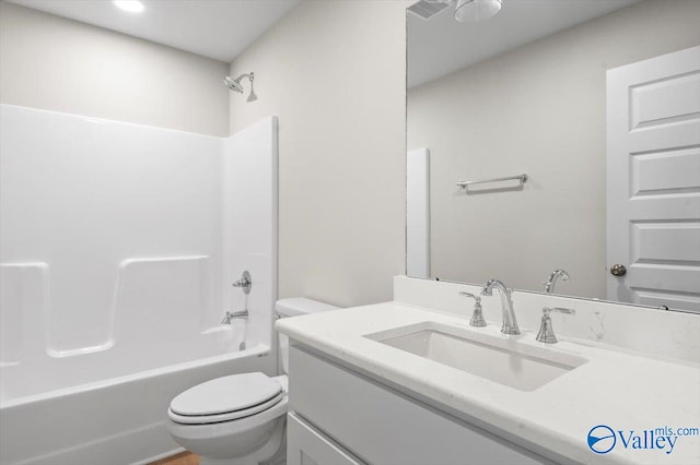 full bathroom with washtub / shower combination, toilet, and vanity