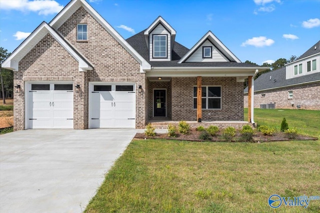 craftsman-style house with a garage, a porch, and a front lawn