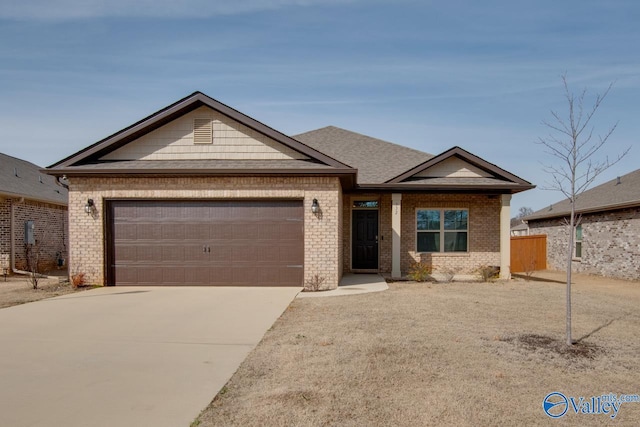 view of front facade featuring concrete driveway, brick siding, and an attached garage