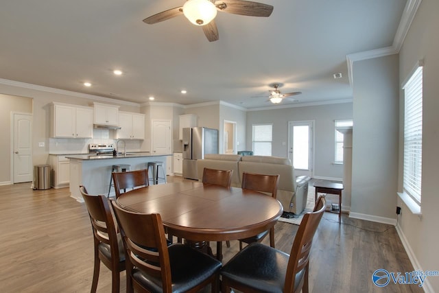 dining space featuring a healthy amount of sunlight and light wood-style flooring