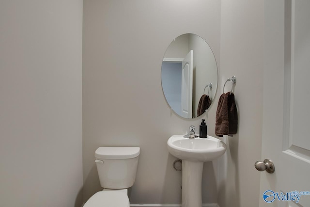 bathroom featuring toilet