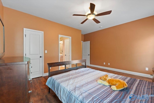 bedroom with dark wood finished floors, baseboards, and a ceiling fan