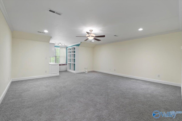 carpeted empty room with a ceiling fan, recessed lighting, crown molding, and baseboards