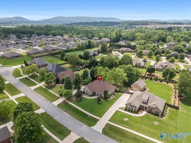 aerial view of residential area with a mountainous background