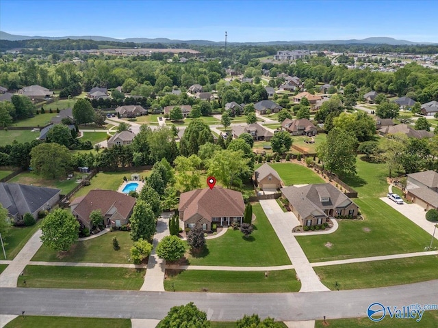aerial perspective of suburban area with a mountainous background