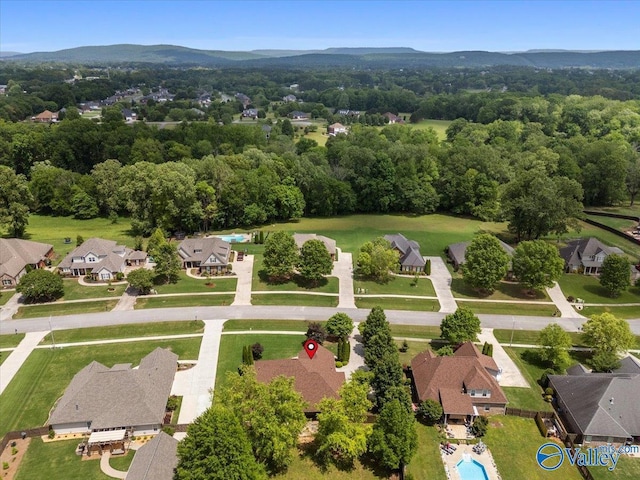 aerial perspective of suburban area with a mountain backdrop
