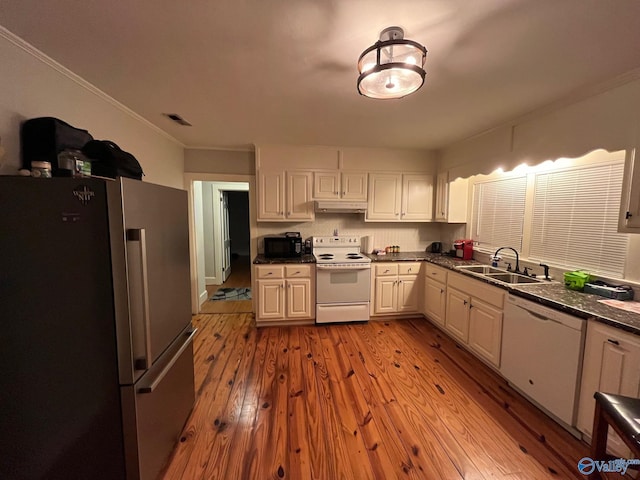 kitchen with white cabinetry, light wood-type flooring, white appliances, and sink