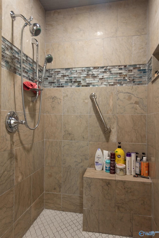 full bath featuring a tile shower