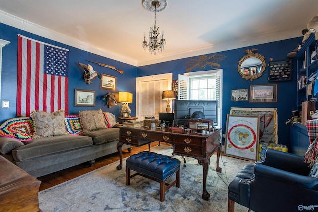 home office with wood finished floors and a notable chandelier