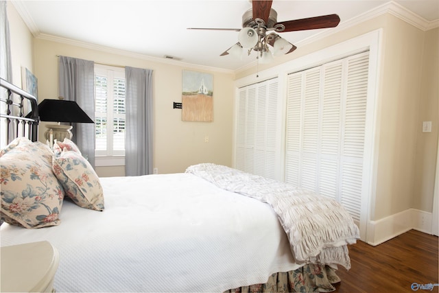 bedroom featuring dark wood-style flooring, crown molding, baseboards, and ceiling fan