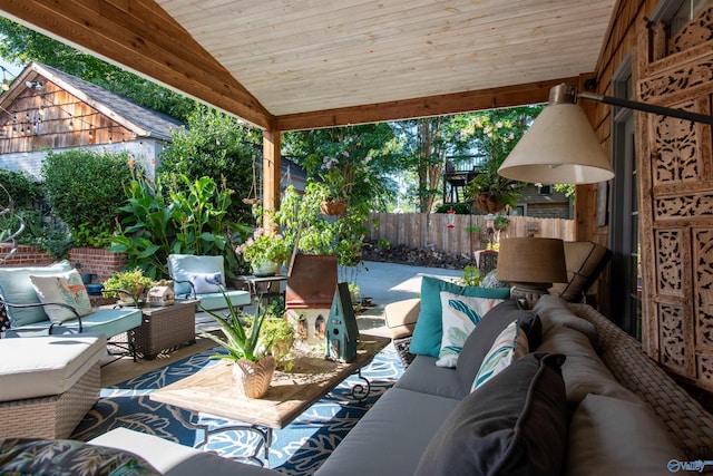 view of patio featuring fence and an outdoor living space