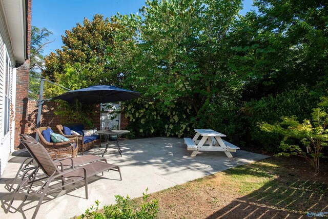 view of patio featuring an outdoor living space and french doors