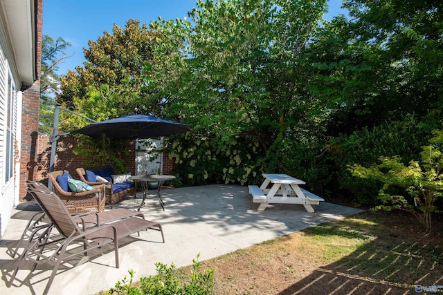 view of patio / terrace with outdoor dining area and an outdoor hangout area