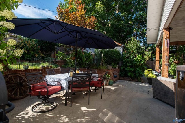 view of patio / terrace featuring french doors, a bar, and outdoor lounge area