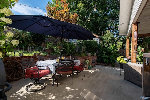 view of patio featuring a fenced backyard and outdoor dining space