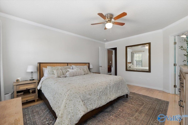 bedroom featuring crown molding, wood-type flooring, a textured ceiling, and ceiling fan